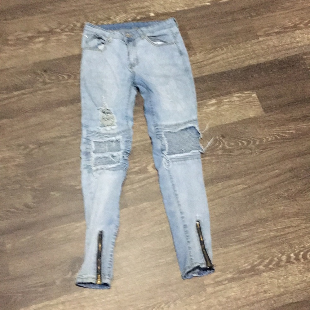 Light blue ripped jeans